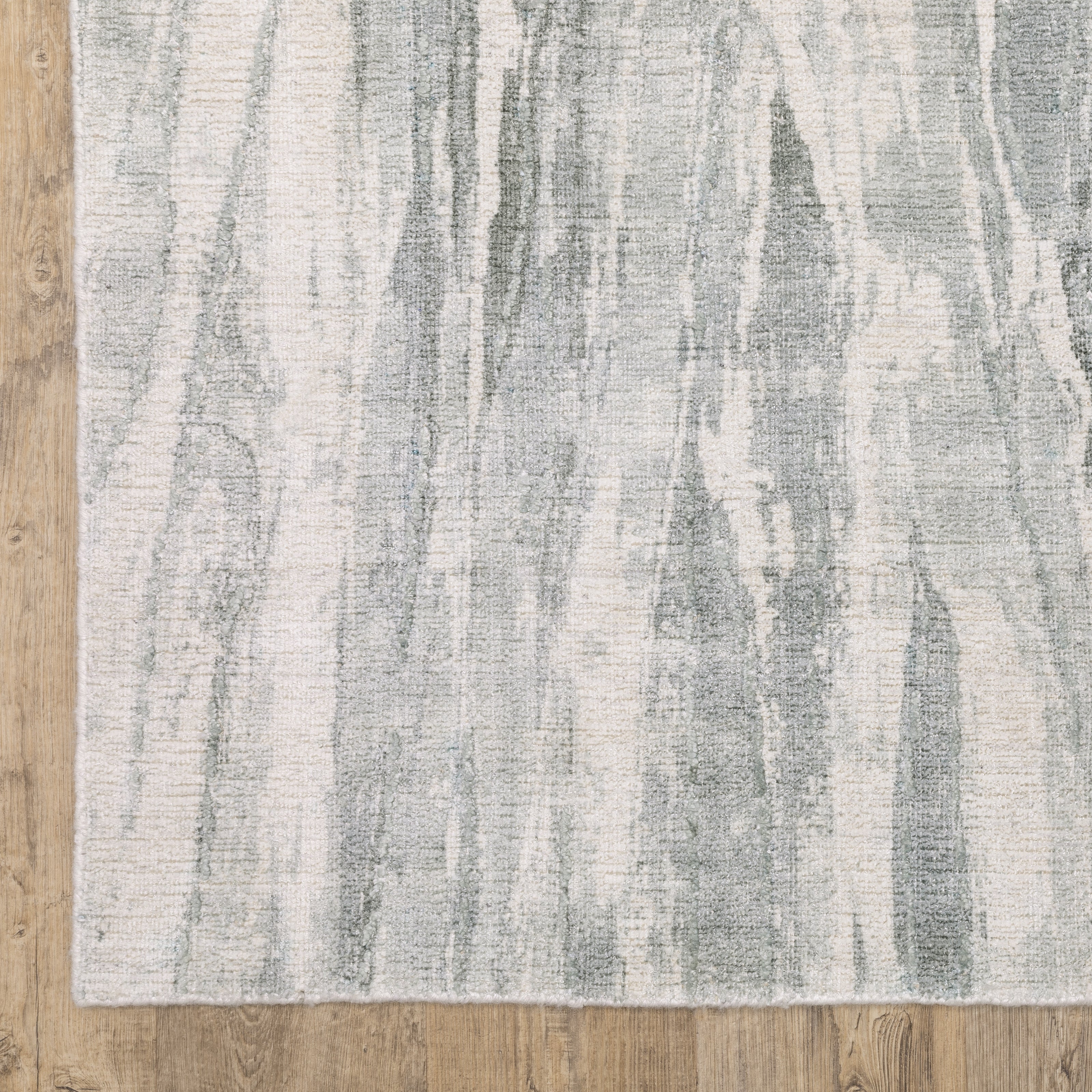 Oriental Weavers Clarke CLA03 soft modern rug featuring abstract pattern in green/ ivory tones