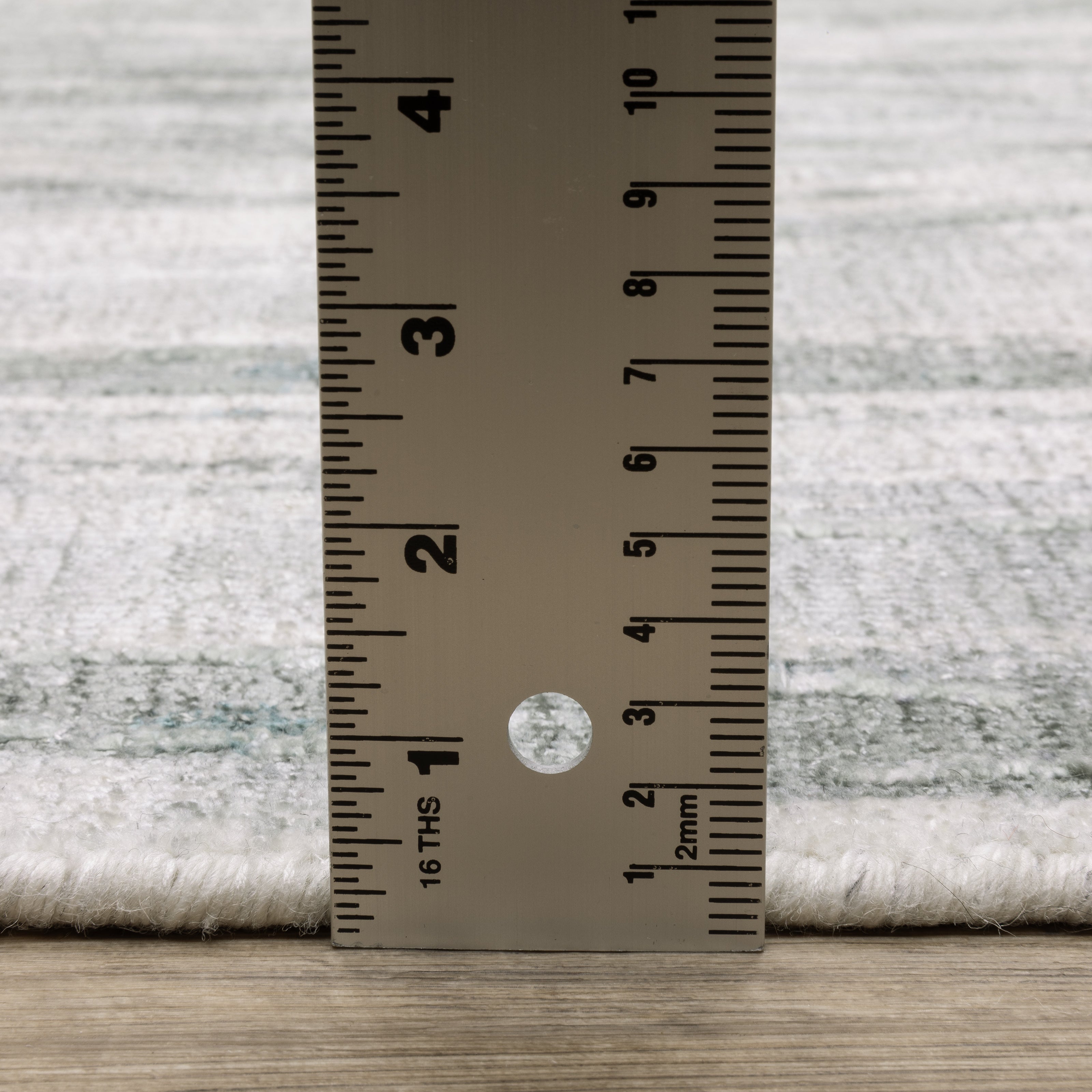 Oriental Weavers Clarke CLA03 soft modern rug featuring abstract pattern in green/ ivory tones