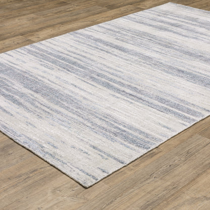 Oriental Weavers Clarke CLA04 soft modern rug featuring abstract pattern in ivory/ blue tones
