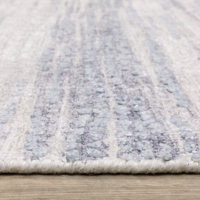 Oriental Weavers Clarke CLA04 soft modern rug featuring abstract pattern in ivory/ blue tones