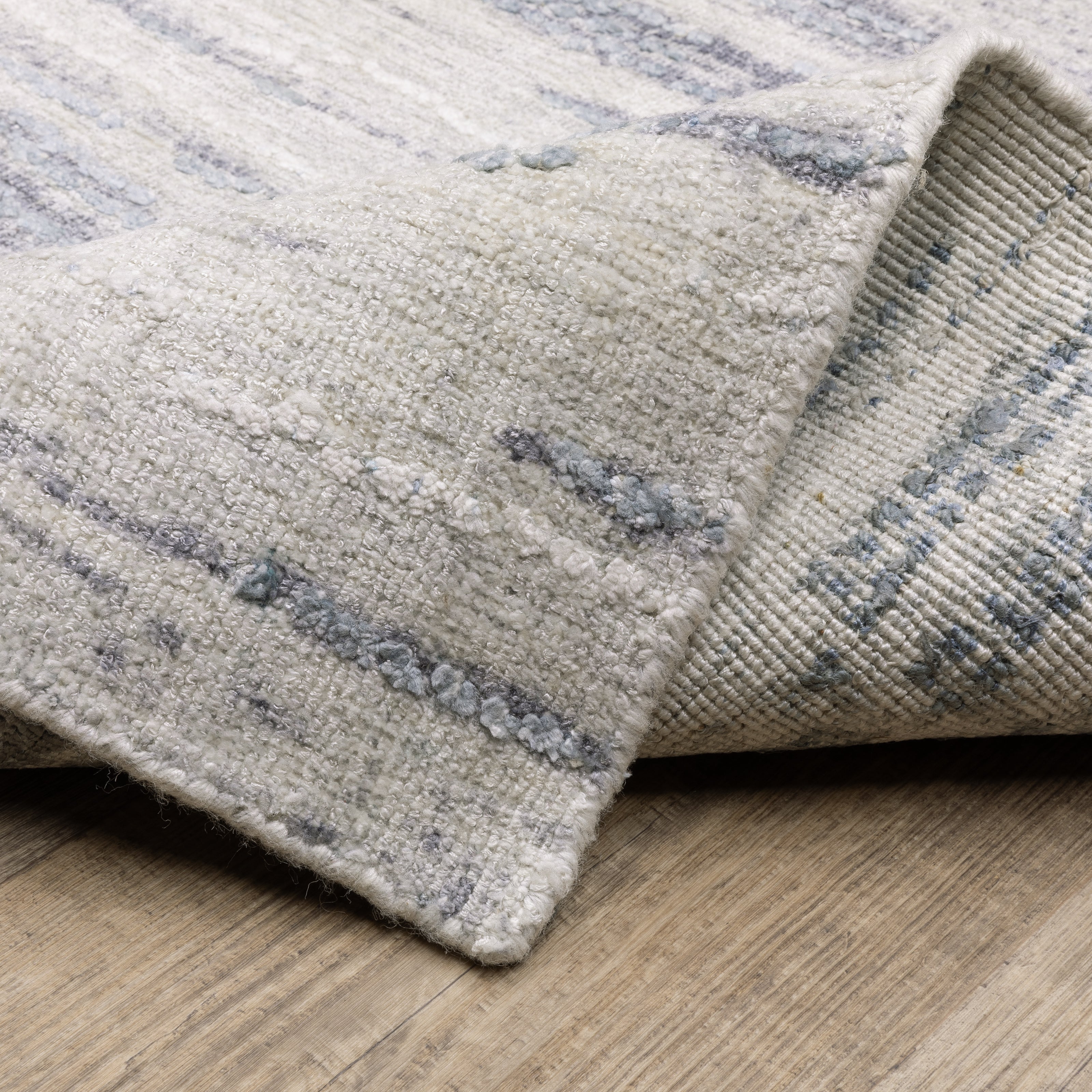 Oriental Weavers Clarke CLA04 soft modern rug featuring abstract pattern in ivory/ blue tones