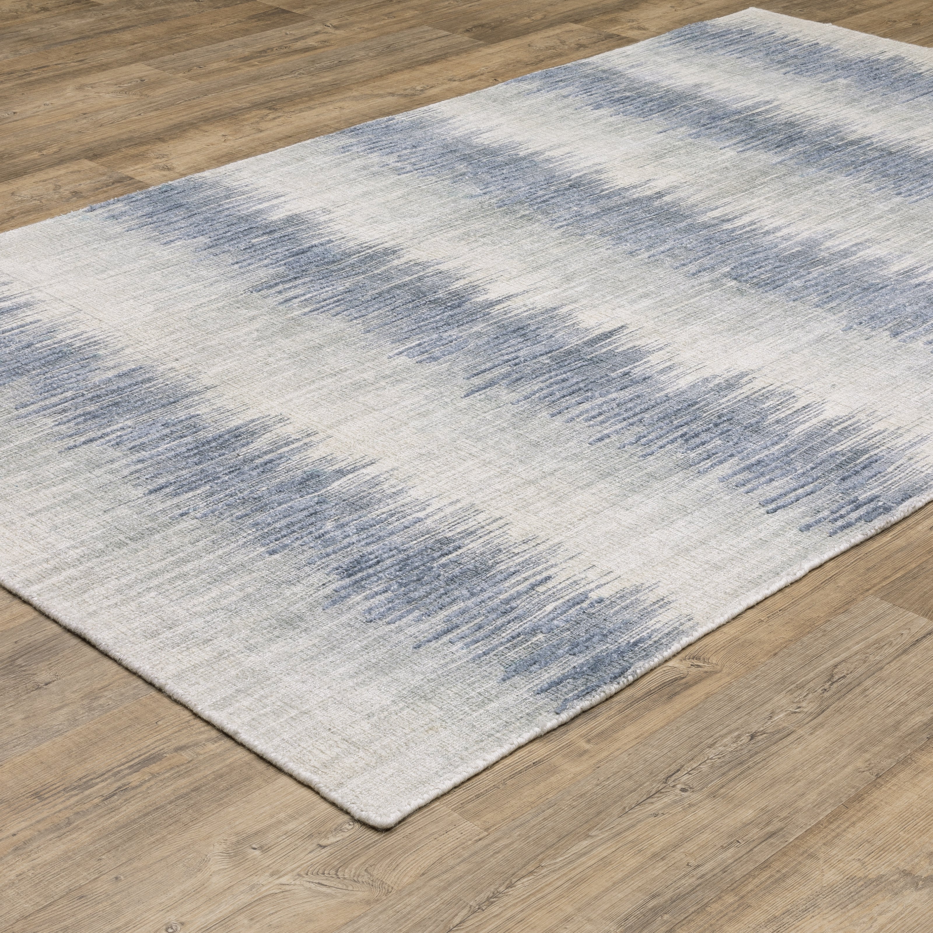 Oriental Weavers Clarke CLA06 soft modern rug featuring abstract pattern in blue/ ivory tones