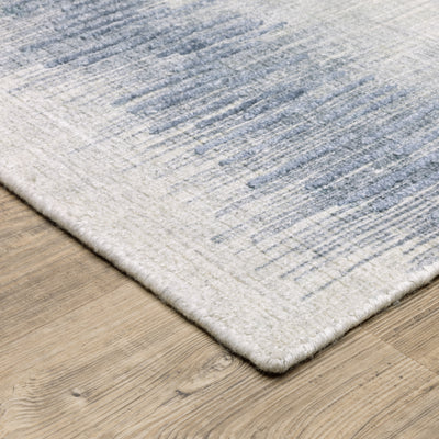 Oriental Weavers Clarke CLA06 soft modern rug featuring abstract pattern in blue/ ivory tones