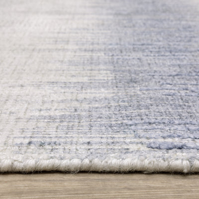 Oriental Weavers Clarke CLA06 soft modern rug featuring abstract pattern in blue/ ivory tones