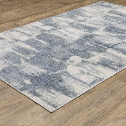 Oriental Weavers Clarke CLA07 soft modern rug featuring abstract pattern in blue/ ivory tones