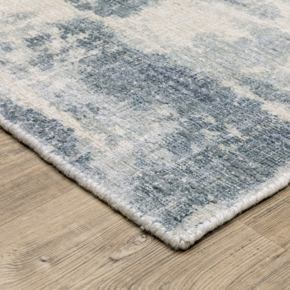 Oriental Weavers Clarke CLA07 soft modern rug featuring abstract pattern in blue/ ivory tones