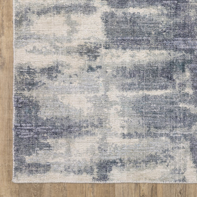 Oriental Weavers Clarke CLA07 soft modern rug featuring abstract pattern in blue/ ivory tones
