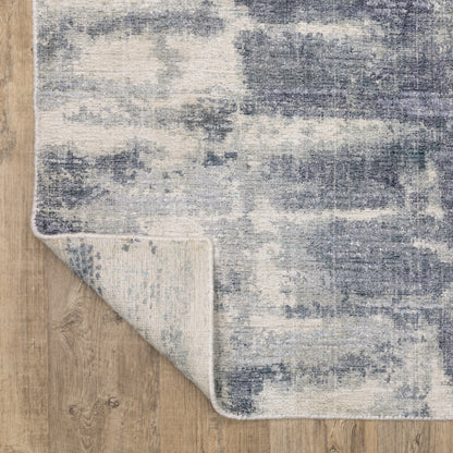 Oriental Weavers Clarke CLA07 soft modern rug featuring abstract pattern in blue/ ivory tones