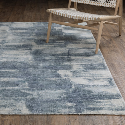 Oriental Weavers Clarke CLA07 soft modern rug featuring abstract pattern in blue/ ivory tones