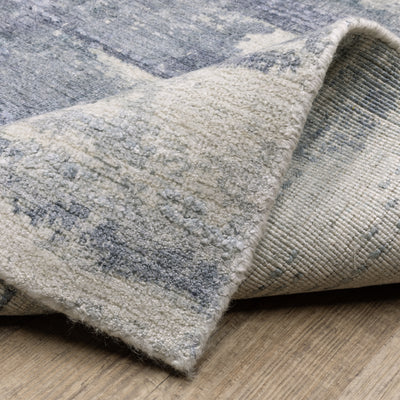 Oriental Weavers Clarke CLA07 soft modern rug featuring abstract pattern in blue/ ivory tones