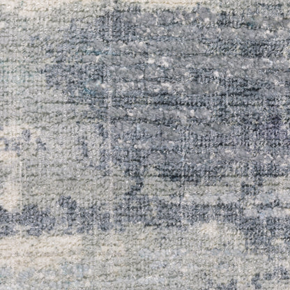 Oriental Weavers Clarke CLA07 soft modern rug featuring abstract pattern in blue/ ivory tones